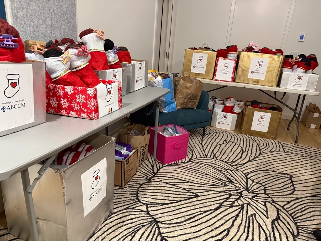 Filled stockings and donated items sorted into bags and boxes for each shelter